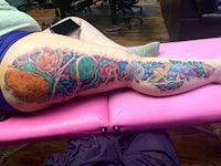 a woman with a tattoo on her thigh